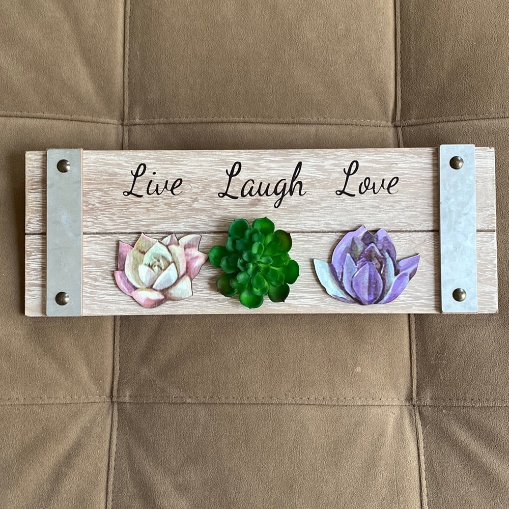 13.5” x 5” wooden hanging sign.  Reads Live, Laugh, Love